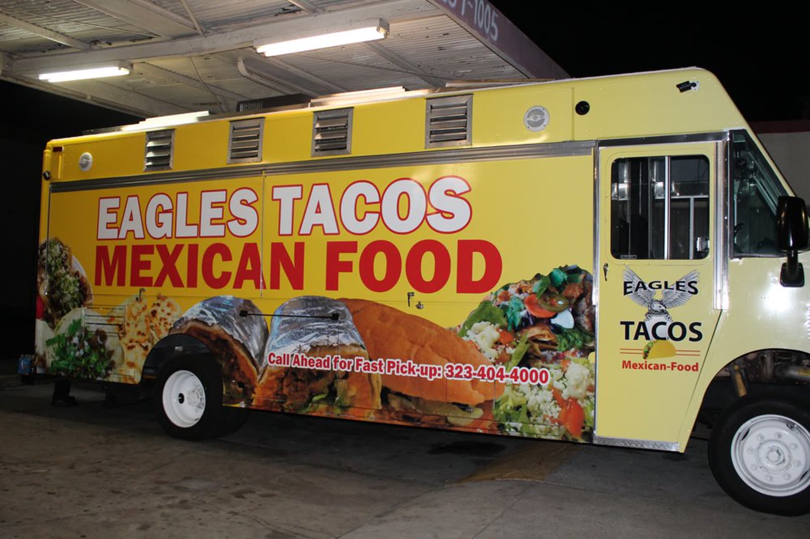 Eagles Tacos yellow food truck side